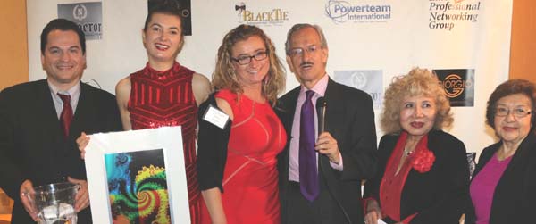   European Model Jana Respo recieving her door prize Original Painting from Artist Henry Sotoin the picture Bill Lee Lanndis, Jana Respo, Margaret Citak, Artist Henry Soto, Gloria T. Cresslerand Maria Cristina Shef