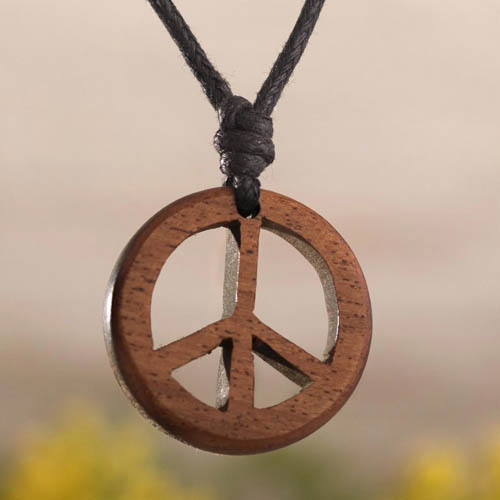 Wood Peace Sign Necklace is designed by Antoine and Santos in Peru.