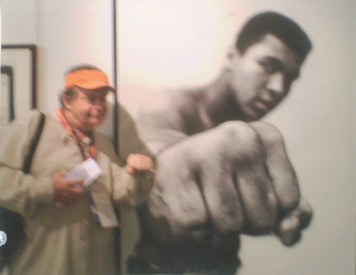 Andrew Wargo/writer, Black Tie Magazine, and Event Coordinator ...with large Cassious Clay photo