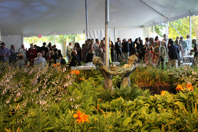 Guests await entry to the dinner tent while enjoying 