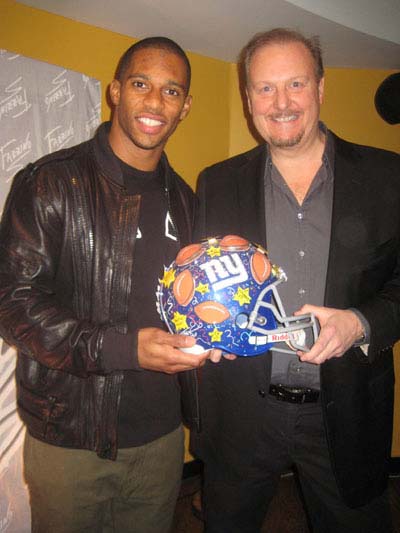 01-17-12 NY Giant Victor Cruz (L) and Charles Fazzino at the unveiling of the Commemorative Superbowl XLVI Artwork by Charles Fazzino at Sofrito. 400 East 57th St . Monday night 01-16-12