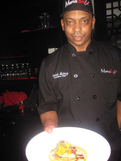 03-27-15 Executive Chef David Nunez displays one of his signature dishes a Pan Seared Striped Bass at a tasting at MamaSushi. 237 Dyckman Street. Thursday night. 03-26-15.  Photo by:  Aubrey Reuben