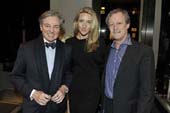 Interior designer, Geoffrey Bradfield with hosts of the Vertu dinner, Casey Gorman and Patrick McMullan