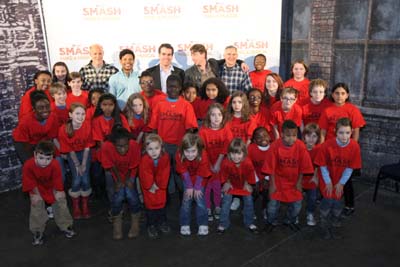 Titled “Smash and Renfroe” – students from Renfroe Middle Scholl in Decatur pose with “Smash” producers and actors. Adults from left: “Smash” executive producer Neil Meron, “Smash” actor Jaime Cepero, “Smash” actor Brian d’Arcy James, “Smash” actor Christian Borle and “Smash” producer Craig Zadan. Photo credit: Wilford Harewood/NBC