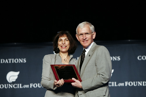 Barbara Dyer, President and CEO of The Hitachi Foundation (left) accepts the 2010 Critical Impact Award from Steve Gunderson, President and CEO of the Council of Foundations during the Council on Foundations annual conference