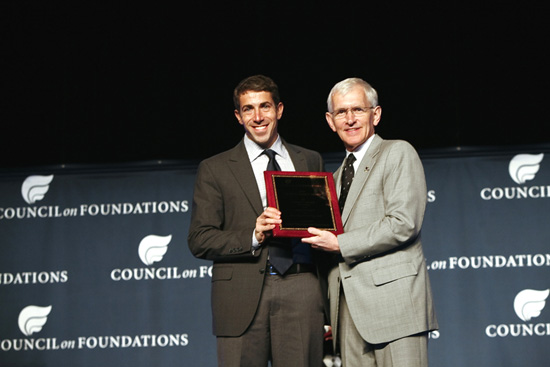Adam Coyne, Director of Public Affairs at the Robert Wood Johnson Foundation (left) accepts the 2010 Critical Impact Award from Steve Gunderson, President and CEO of the Council of Foundations during the Council on Foundations annual conference in Denver, Colo., on behalf of their support and collaboration with the Hitachi Foundation for launching Jobs to Careers, a health care frontline worker program