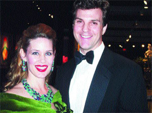 Table Design Committee - Artist, Michelle Marie with her husband Jon L. Heinemann. Michelle deputed her bronze sculpture Winter Tree, SEASONS. Photo by: Joyce Brooks / Black Tie International