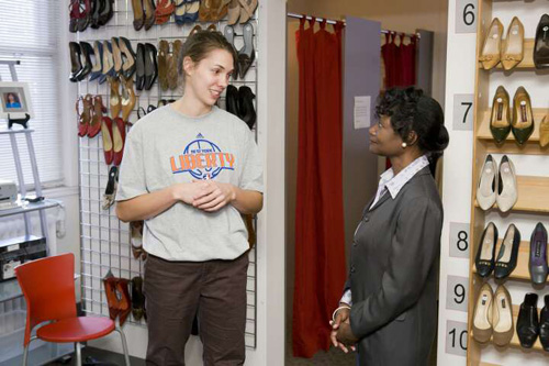 New York Liberty forward Sidney Spencer speaks with a Bottomless Closet client