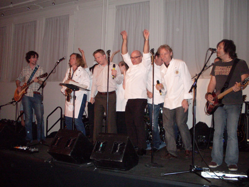 Chefs, including Ron Ben-Israel and Matthew Tivy, perform with Arlene's Grocery's Rock n Roll Karaoke band at City Harvest's 'Summer in the City' event on