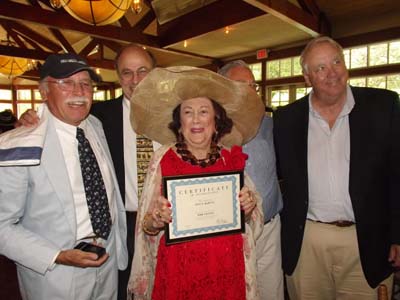 Lucy receives a certificate from her son's friends. Andy Meyers, Barry Shapiro, Charles Zimmerman and Brian Welch. The GENTS Club was formed when her son Peter and his friends were 14 years old. Lucy is now an Honorary member of the GENTS Club as well as the only female member