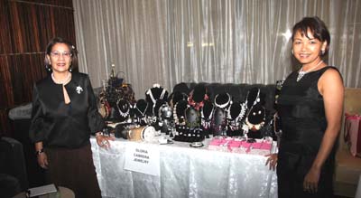 Gloria Cabrera and Tess Medina at there table of Gloria Cabrera Jewelry 
