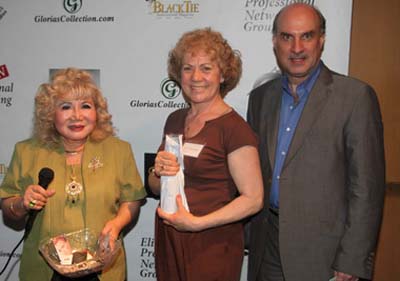 Gloria T. Cressler, Paula Oleska & Dr. Tom Mallios when Paula receives her door Prize.