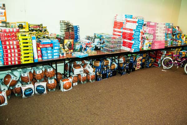 Piles of gift donations at Federation of Protestant Welfare Agency headquarters. Credit: Robert White