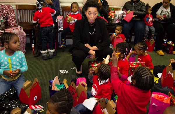 FPWA Executive Director Jennifer Jones Austin and children from the Mary McLeod Bethune Day Care Center. Credit: Robert White