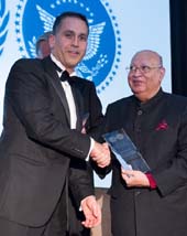 Lord Raj Loomba, Founder and Chairman Trustee, The Loomba Foundation receiving award from Abid Qureshi, UNA-NY President