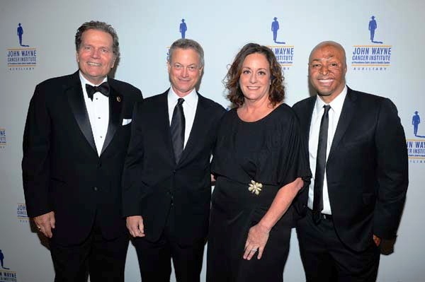 Patrick Wayne (JWCI Chairman & son of JohnWayne), True Grit honoree Gary Sinise, Anita Swift (JWCI Auxiliary President and granddaughter of John Wayne) and emcee/presenter JR Martinez. Photo by:  Vince Bucci