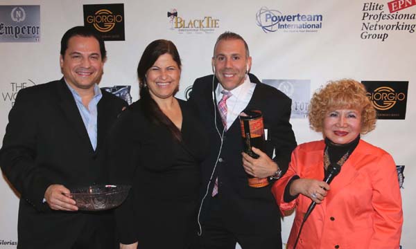 Dr. Jeff Rosenberg receiving his door prize from Orly Amor President of Health & Wellness Network of Commerce Corporation.