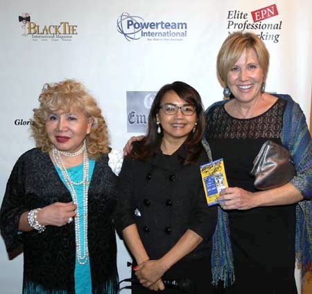 Diane McGraw receiving her door price from Tess Medina of Rehab World Physical Therapy and Acupuncture Sponsor.