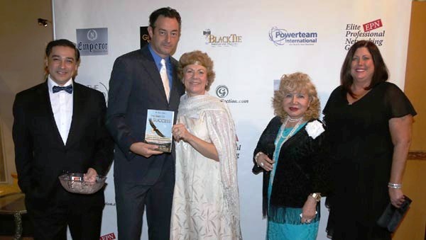  Richard Alan receiving her door prize from Paula Oleska President of Brain Upgrade Sponsor 