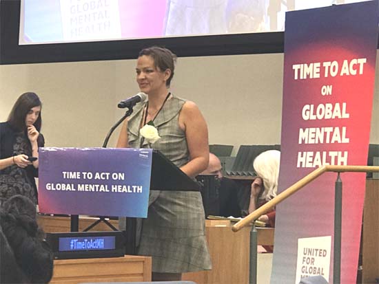 Elisha London, personally committed to helping others as she was once helped, reflects on the 135 white roses handed out to the attendees, symbolizing the number of people that will die of suicide during the course of the event, as a lead-in to outline why now is the time for a united movement