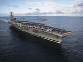 The Nimitz-class aircraft carrier USS George H.W. Bush (CVN 77), Ticonderoga-class guided-missile cruiser USS Philippine Sea (CG 58), and the Arleigh Burke-class guided-missile destroyer USS Donald Cook (DDG 75) operate in formation during exercise Saxon Warrior 2017. The United States and United Kingdom co-hosted carrier strike group exercise demonstrates interoperability and capability to respond to crises and deter potential threats. (U.S. Navy photo by Mass Communication Specialist 2nd Class Michael B. Zingaro/Released)