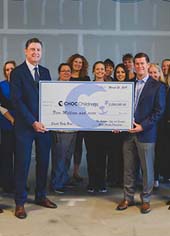 eff and Jennifer Gross present a $5 million donation to members of the CHOC Foundation and CHOC's neonatal intensive care unit Photo courtesy of CHOC Children's