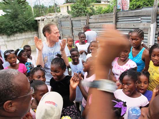 Russell singing with children in Haiti