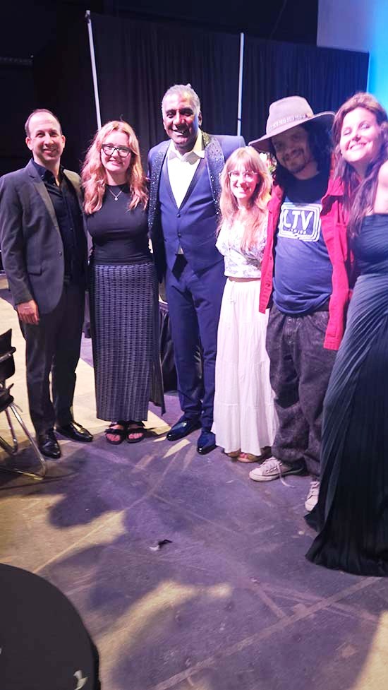 Norm Lewis greeted by staff LTV