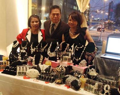 Gloria Cabrera of Gloria Cabrera Salon and Spa & Jewelry, Marshall Factora and Tess Medina in there Display table as an sponsor.