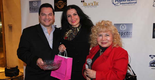   Lona Alawi receiving her door prize from us