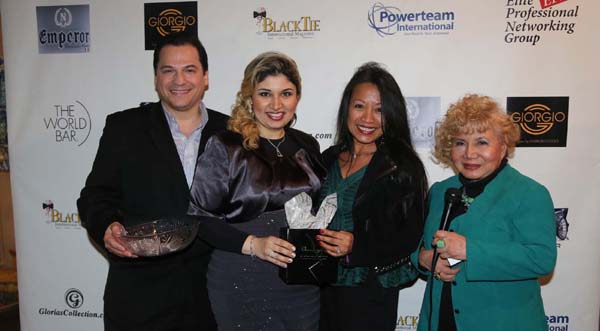 Yelena Kalendareva Founder/CEO Aneley Cosmetics giving the door prize to rhora guinto lebrun