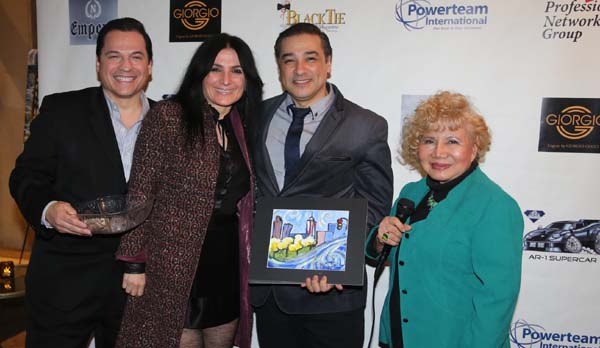  Lona Alawi recieving his door prize original painting from artist Fernando Silva