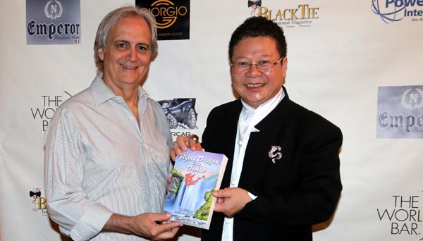 Award Winning Producer, Director Writer Dean Love Receiving his door prize from Fei Long