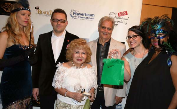   Gloria T. Cressler presenting  the prize for the runner up for the best costume. 3rd runner up winner, Kathryn Weisbeck  and the 2nd prize winner was  Robin Vetere.