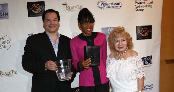   Dr. Vera Gilford receiving her door prize.