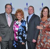 Patrick Wayne (son of John Wayne and Chairman, John Wayne Cancer Institute), honorees Sheri Rosenblum and Jason Jeralds, and Anita Swift (granddaughter of John Wayne and President, John Wayne Cancer Institute Auxiliary). Photo by: Vince Bucci