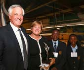 Rich Brennan, Susan George, students from Our Lady of Grace. Photo by: Joe Vericker/PhotoBureau