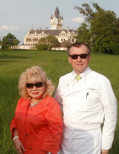   Chef Morwald and Gloria Cressler in front of Grafenegg Castle in Grafenegg Austria were one of     Chef Morwald Hotel is located.
